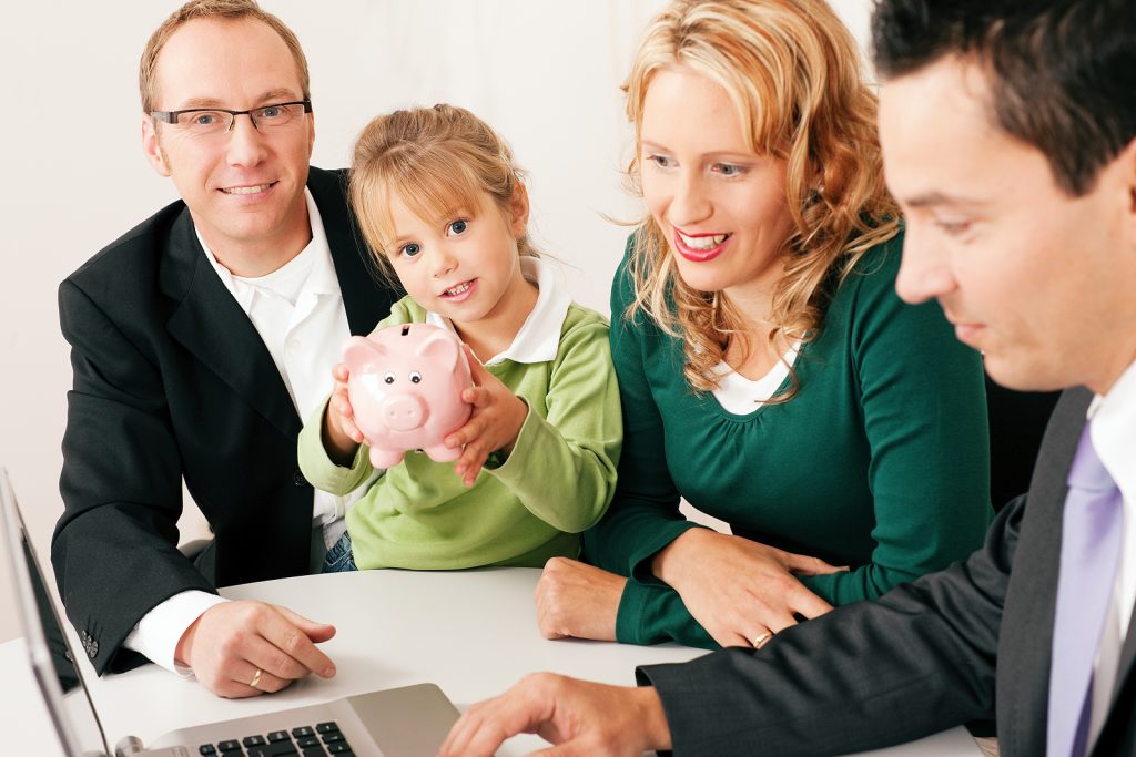 Family with their consultant (assets, money or similar) doing some financial planning