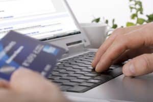 Online shopping using a credit card to complete an e-commerce transaction
